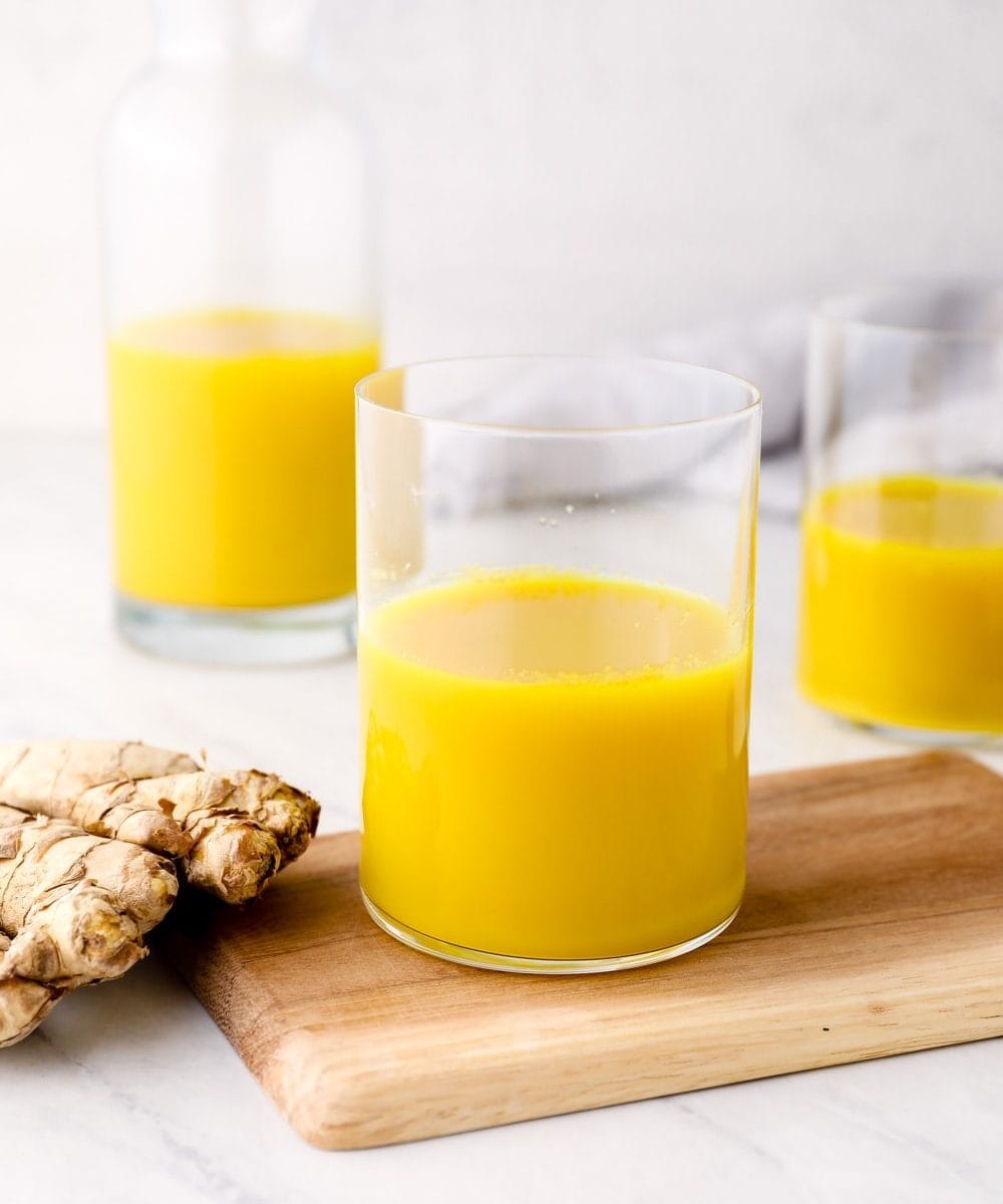Ginger Juice in glasses with honey.