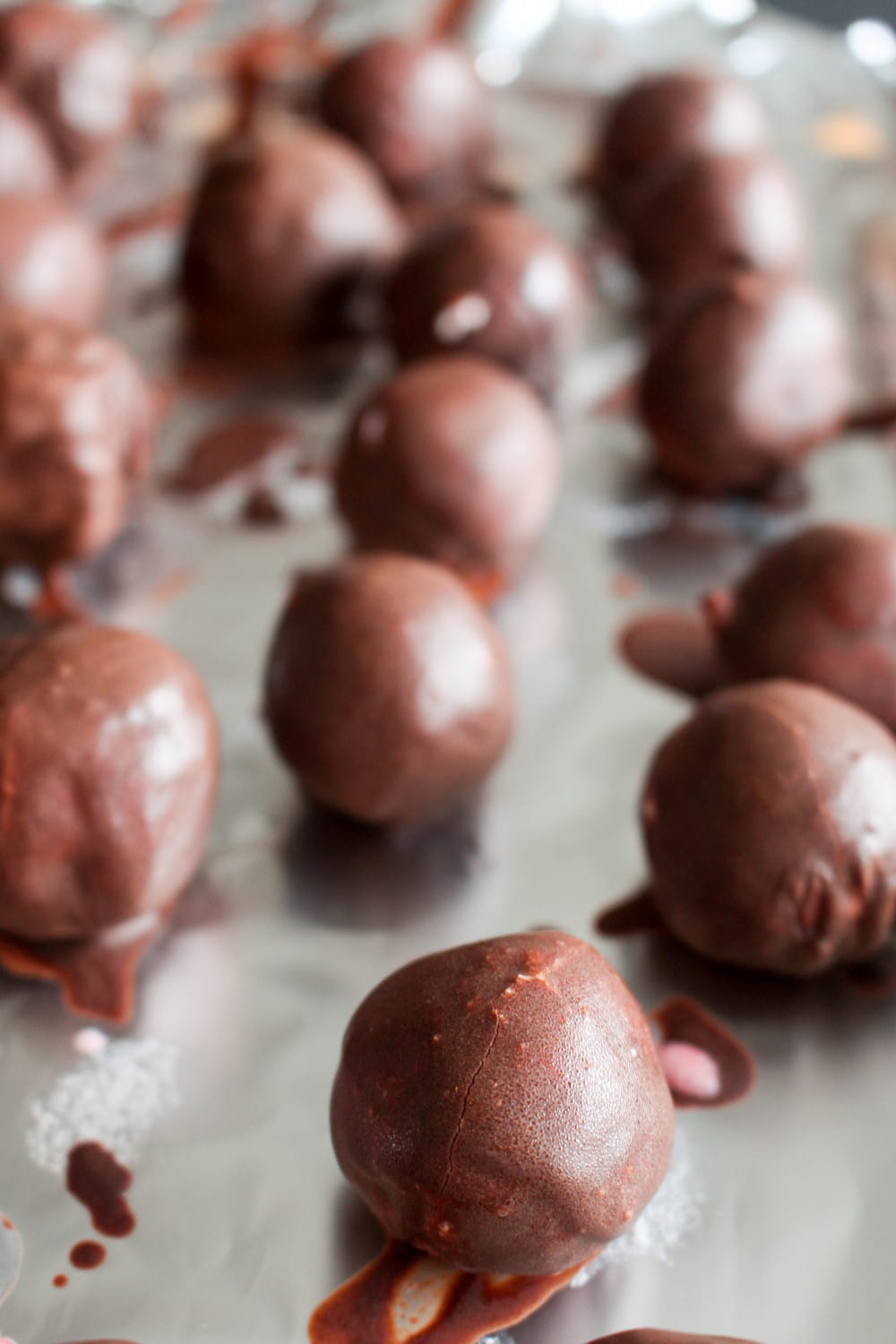 These secretly healthy truffles have a creamy strawberry center and are covered in velvety chocolate.