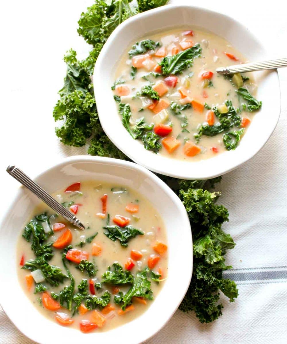 You will never believe this Sweet Potato Kale Chowder Recipe is secretly healthy! It is SO incredibly creamy. Find out the secret trick for thick and creamy dairy-free soup! | CatchingSeeds.com