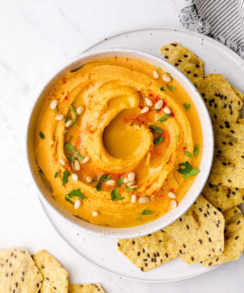 Sweet Potato Hummus in a bowl with olive oil and paprika.