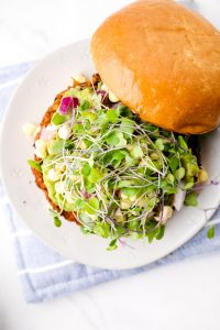 A California Burger veggie patty with sprouts.