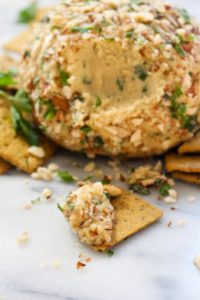 This Vegan Cheese Ball with Herbs is a make-ahead party appetizer that is sure to please a crowd! It is rich, creamy, spreadable, and full of fresh herb flavor.