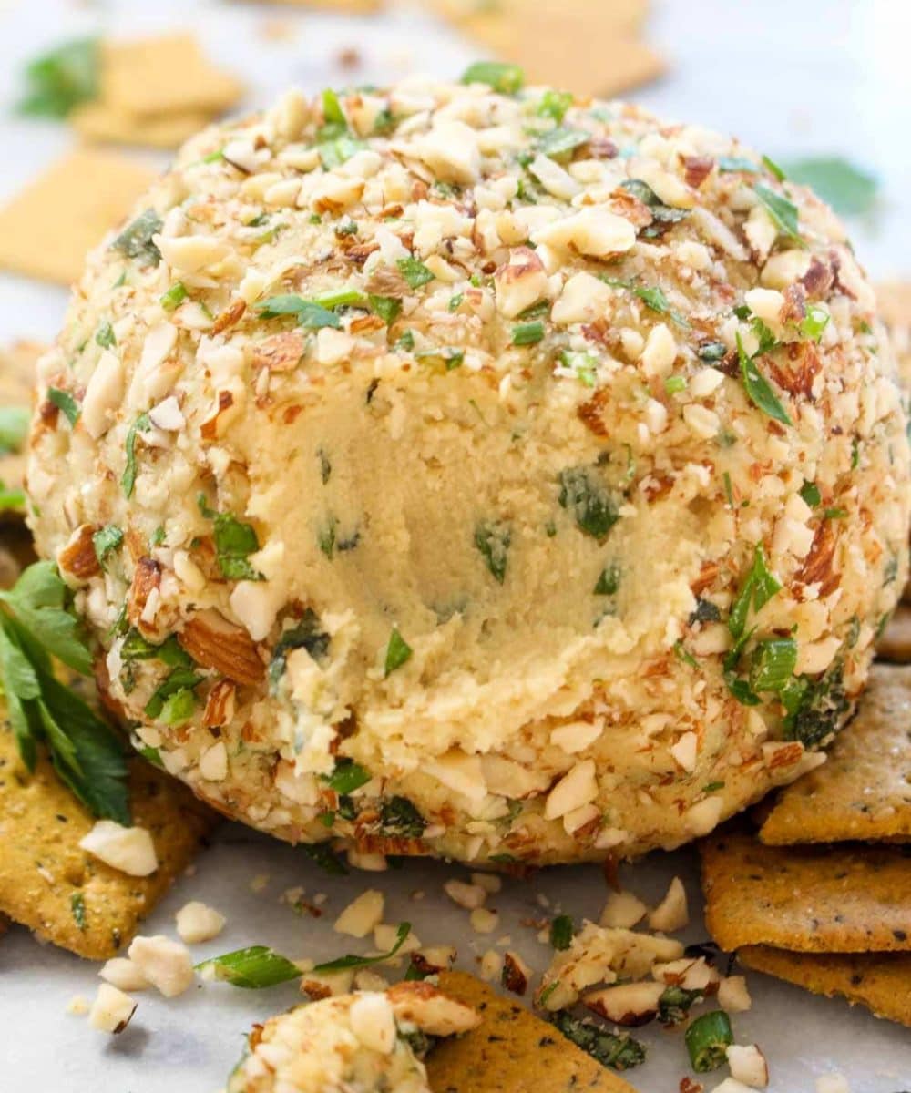 This Vegan Cheese Ball with Herbs is a make-ahead party appetizer that is sure to please a crowd! It is rich, creamy, spreadable, and full of fresh herb flavor.