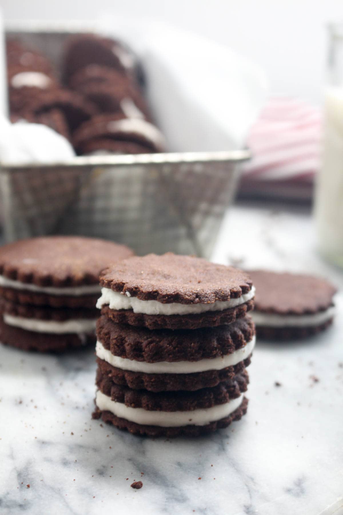 These Homemade Peppermint Oreo Cookies are a gluten free and vegan recipe that will knock everyone's socks off! A perfect Christmas dessert with crisp chocolate wafer cookies, and dense soft peppermint infused filling. Perfect for dunking in milk. | CatchingSeeds.com 