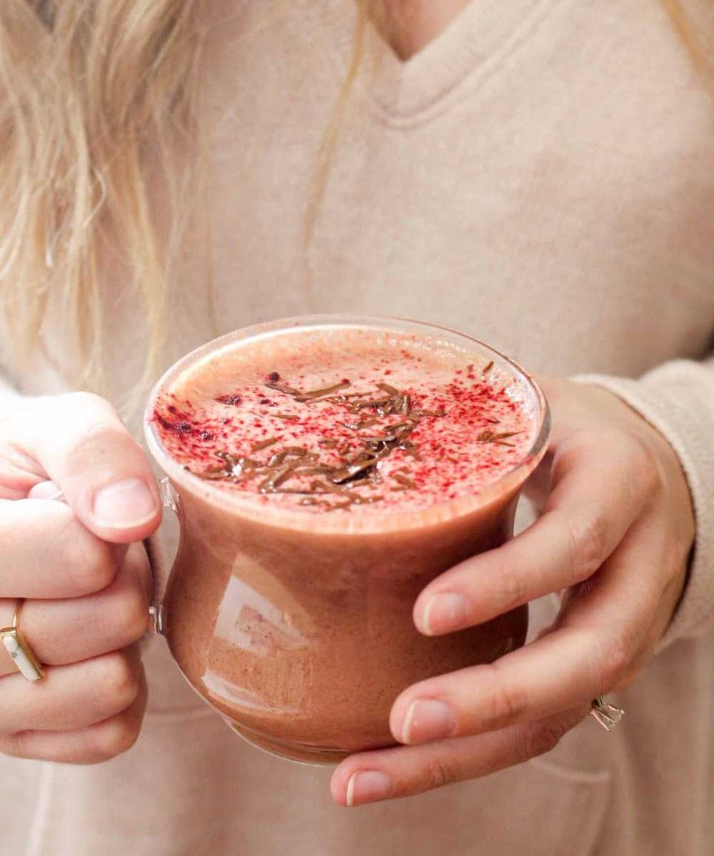 This Red Velvet Hot Chocolate recipe is a secretly healthy vegan treat. This recipe requires just 4 healthy ingredients and takes 5 minutes to make! | CatchingSeeds.com