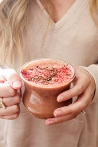 This Red Velvet Hot Chocolate recipe is a secretly healthy vegan treat. This recipe requires just 4 healthy ingredients and takes 5 minutes to make! | CatchingSeeds.com