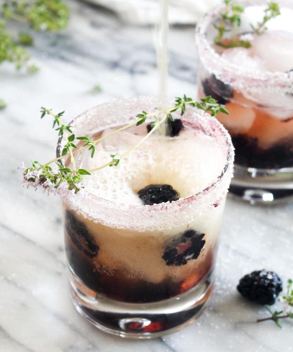 This Blackberry Kombucha Vodka Smash is a light and refreshing cocktail recipe for summer nights! This low sugar drink is made healthier with kombucha. | CatchingSeeds.com