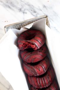 These Baked Double Chocolate Beet Donuts might sound strange, but they are deeply chocolaty, rich and have the perfect soft texture. This healthy dessert recipe is vegan and gluten-free. | CatchingSeeds.com