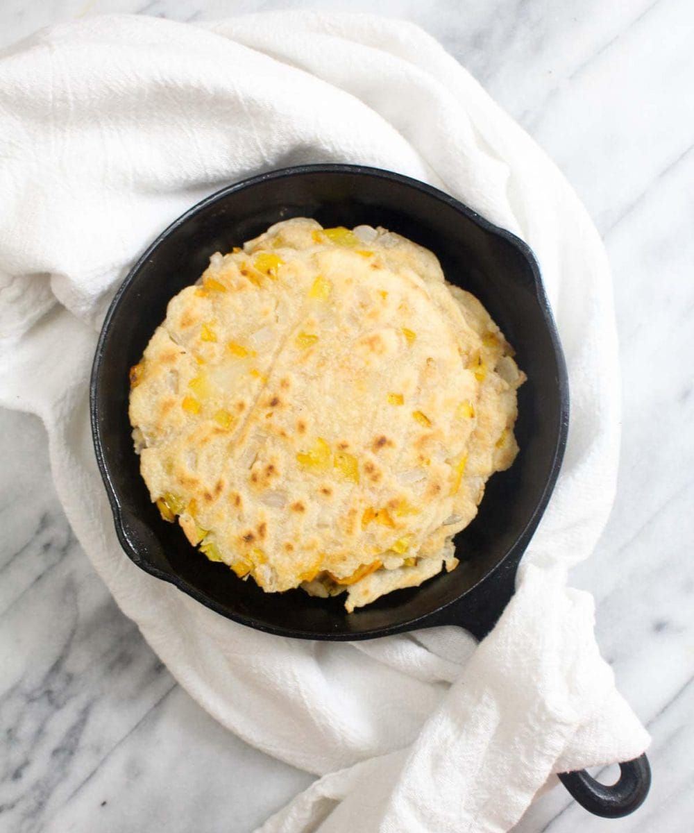 Casava Flatbread is an easy to make grain free and paleo flatbread. It is soft, flexible and full of onions and peppers to give it loads of flavor. | CatchingSeeds.com