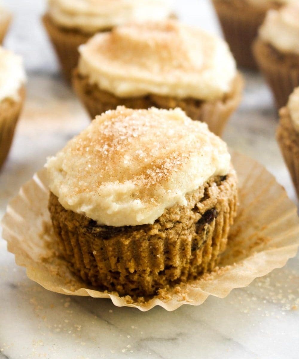 Cinnamon Raisin Cupcakes with Cashew Cream Cheese Frosting is a recipe that tastes like a cinnamon roll in muffin form. These might taste like cupcakes, but they are healthy enough to eat for breakfast! | CatchingSeeds.com