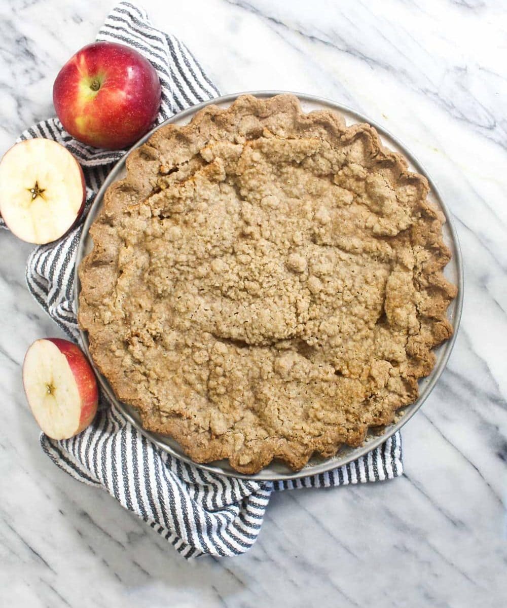 This Dutch Apple Pie is a gluten-free and dairy-free pie that everyone will love! The flaky tender crust, juicy apples, and spiced crumble topping can't be beat. | CatchingSeeds.com