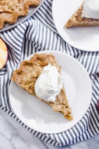 This Dutch Apple Pie is a gluten-free and dairy-free pie that everyone will love! The flaky tender crust, juicy apples, and spiced crumble topping can't be beat. | CatchingSeeds.com