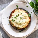 Ricotta Stuffed Portobello Mushrooms are an easy 7-ingredient recipe that can be made in under an hour! This lasagna-esque creamy and comforting main dish recipe is dairy-free! | CatchingSeeds.com