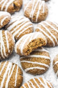 These Soft Ginger Cookies with Eggnog Glaze are a gluten free and vegan holiday dessert that everyone can enjoy! The soft spiced cookie gets topped with a sweet and creamy glaze. A secret ingredient keeps these cookies soft! | CatchingSeeds.com