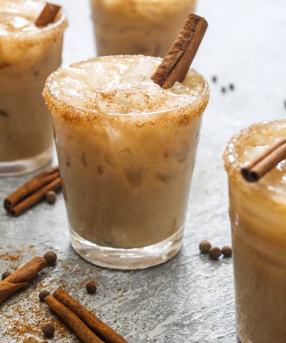 This Almond Spiced White Russian recipe is a fun holiday twist on the traditional cocktail! For a dairy free drink, almond milk gets steeped with spices like cinnamon and nutmeg to infuse this beverage with flavor. | CatchingSeeds.com