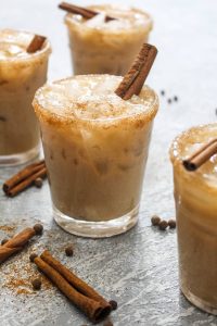 This Almond Spiced White Russian recipe is a fun holiday twist on the traditional cocktail! For a dairy free drink, almond milk gets steeped with spices like cinnamon and nutmeg to infuse this beverage with flavor. | CatchingSeeds.com