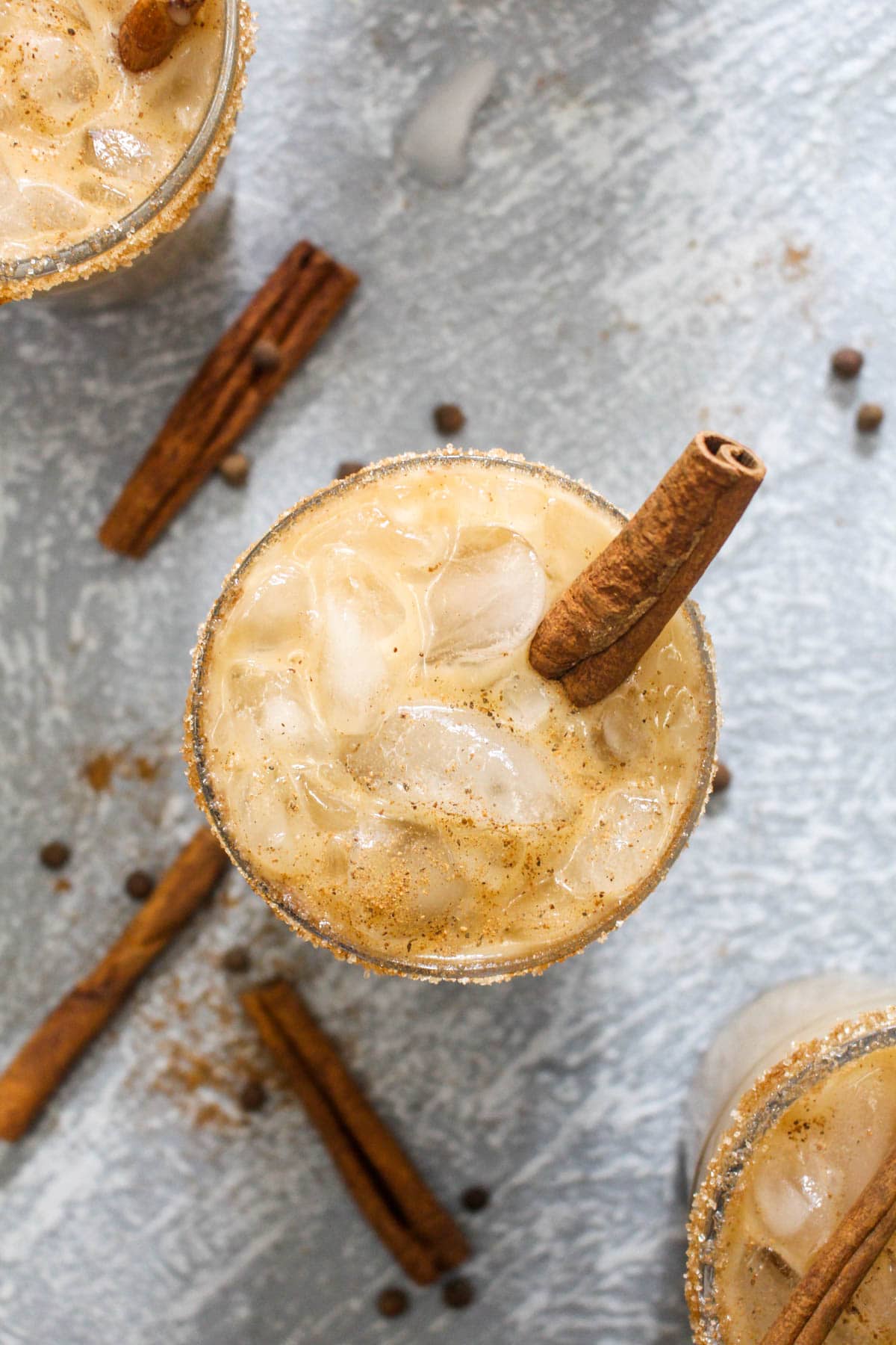 This Almond Spiced White Russian recipe is a fun holiday twist on the traditional cocktail! For a dairy free drink, almond milk gets steeped with spices like cinnamon and nutmeg to infuse this beverage with flavor. | CatchingSeeds.com
