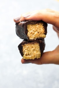 Healthy Salted Caramel Coconut Candy Bars are a party of sweet flavors that also happens to be paleo, gluten-free, and vegan! Healthy ingredients in this recipe combine to make a nutrient-packed dessert or snack. | CatchingSeeds.com