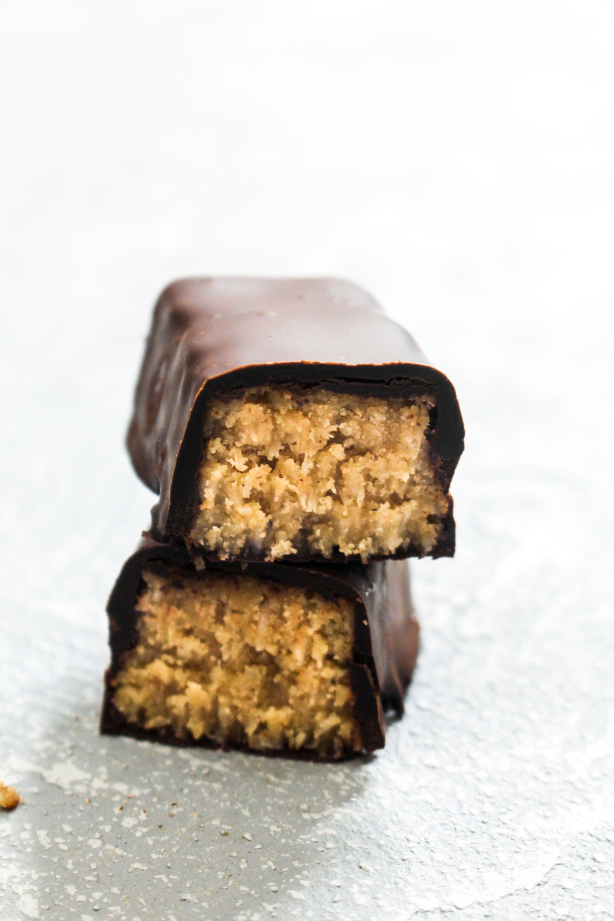 Healthy Salted Caramel Coconut Candy Bars are a party of sweet flavors that also happens to be paleo, gluten-free, and vegan! Healthy ingredients in this recipe combine to make a nutrient-packed desert or snack. | CatchingSeeds.com