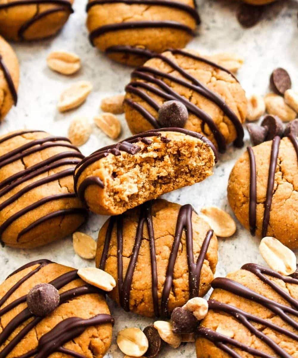 These Peanut Butter Protein Cookies are a sweet treat that are secretly healthy! Fuel up with one of these vegan, gluten free, and even oil free cookies as your pre or post workout snack. With just 6 ingredients, you'll be making this easy recipe all the time. | CatchingSeeds.com