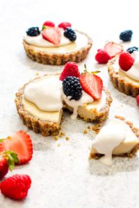 This White Chocolate Lemon Cream Tart is not only a show-stopping recipe, it is an easy 7 ingredient no bake dessert! Using natural sweeteners and whole foods, this tart is healthy, vegan, paleo, and grain free! Everyone will want to take a bite out of this lusciously creamy treat. | CatchingSeeds.com