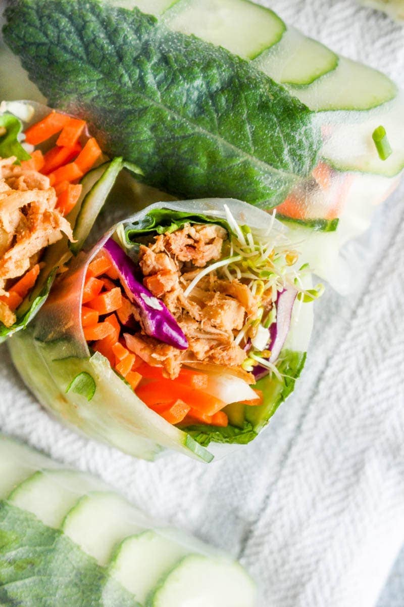 Peanut Sauce Jackfruit Summer Rolls are made with a 5 minute peanut sauce, crunchy vegetables, and fragrant herbs! This healthy gluten free & vegan recipe is bursting at the seams with flavor! | CatchingSeeds.com
