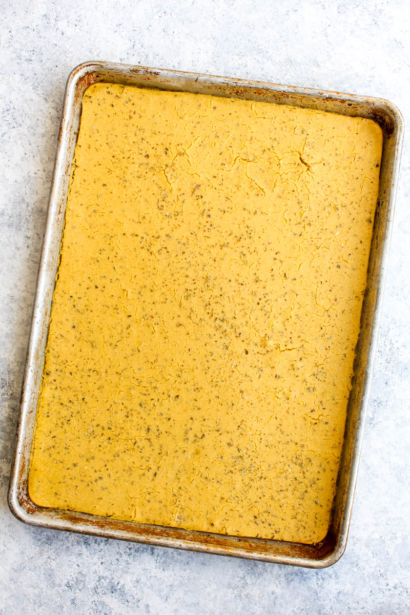 A sheet pan with grain free chickpea flatbread.