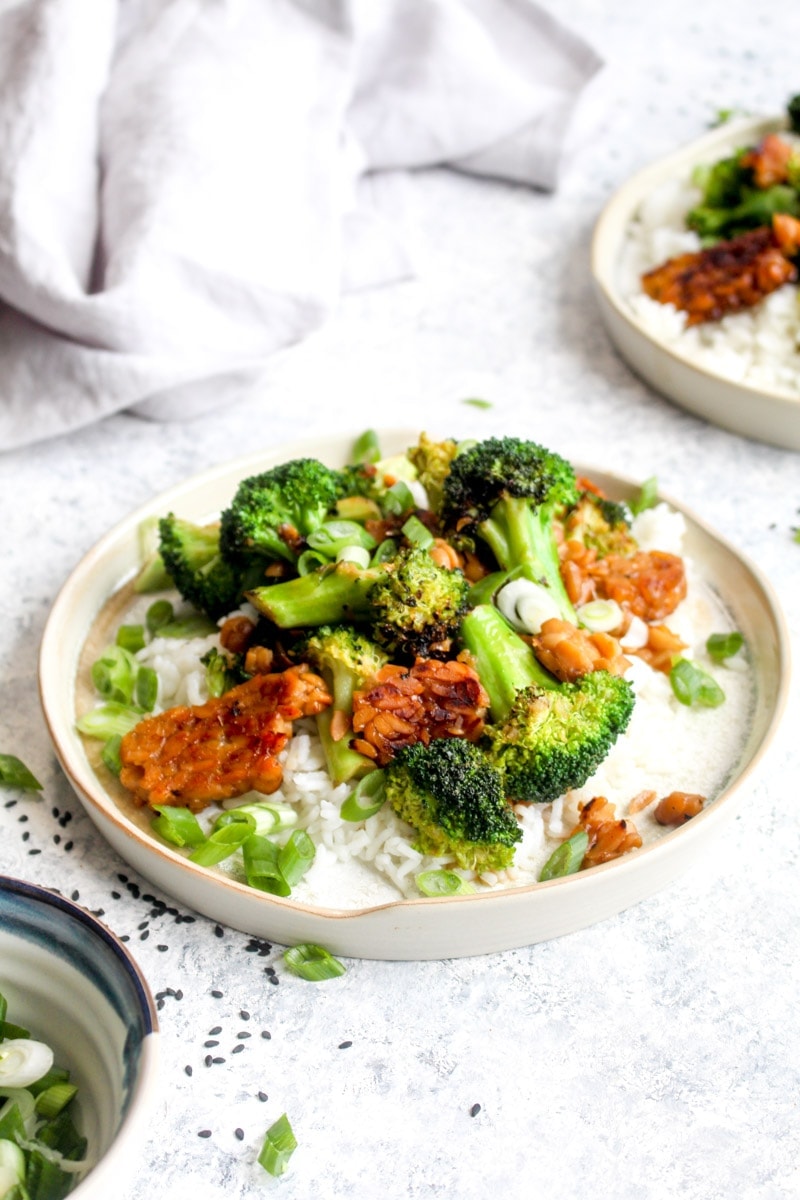 Tempeh broccoli stir fry on rice with scallions. 