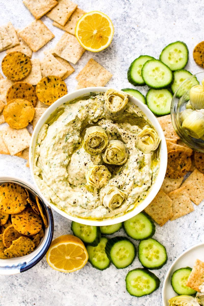 A bowl of finished spinach artichoke hummus.