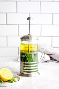 Fresh mint tea being made in a french press.