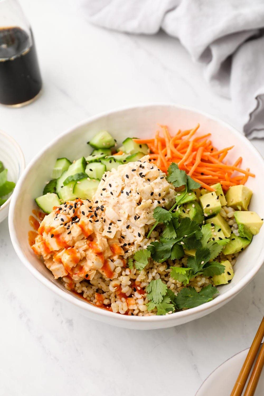 Vegan sushi bowl with brown rice and veggies.