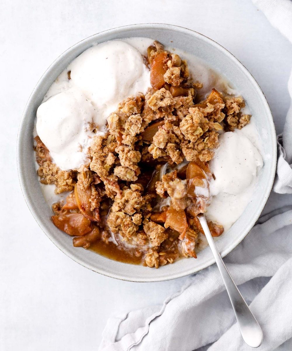 Gluten free apple crisp with oat crumble and vegan ice cream.