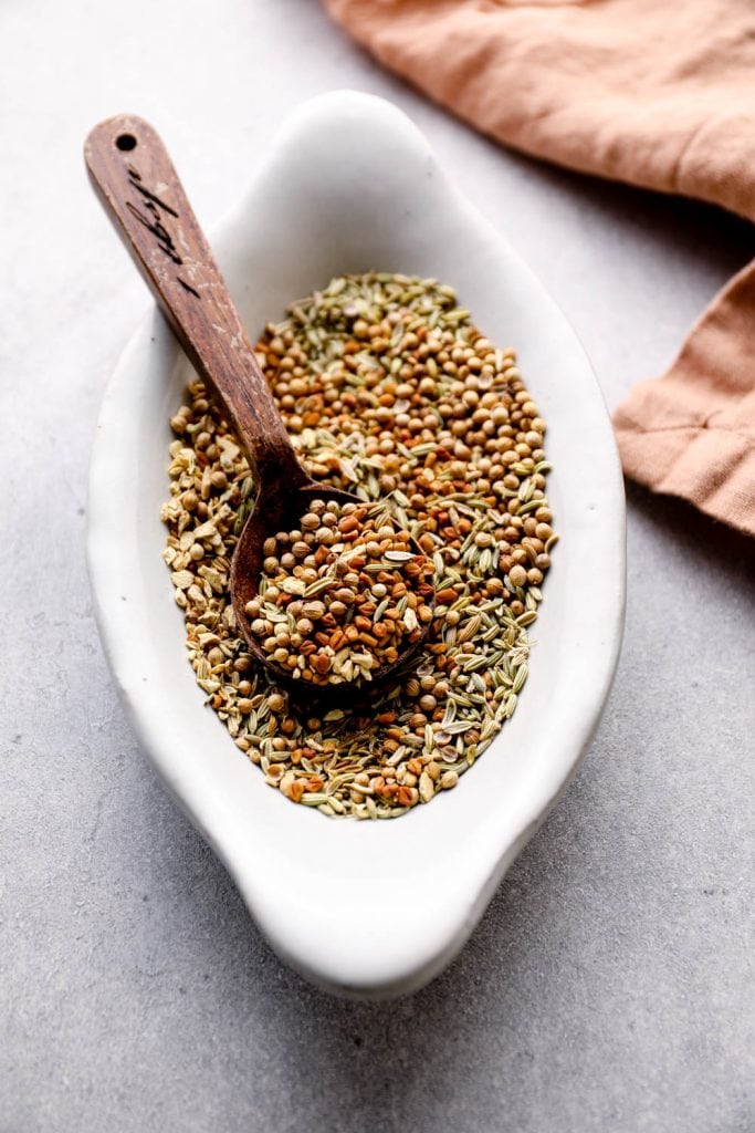Whole spices mixed together in a bowl.