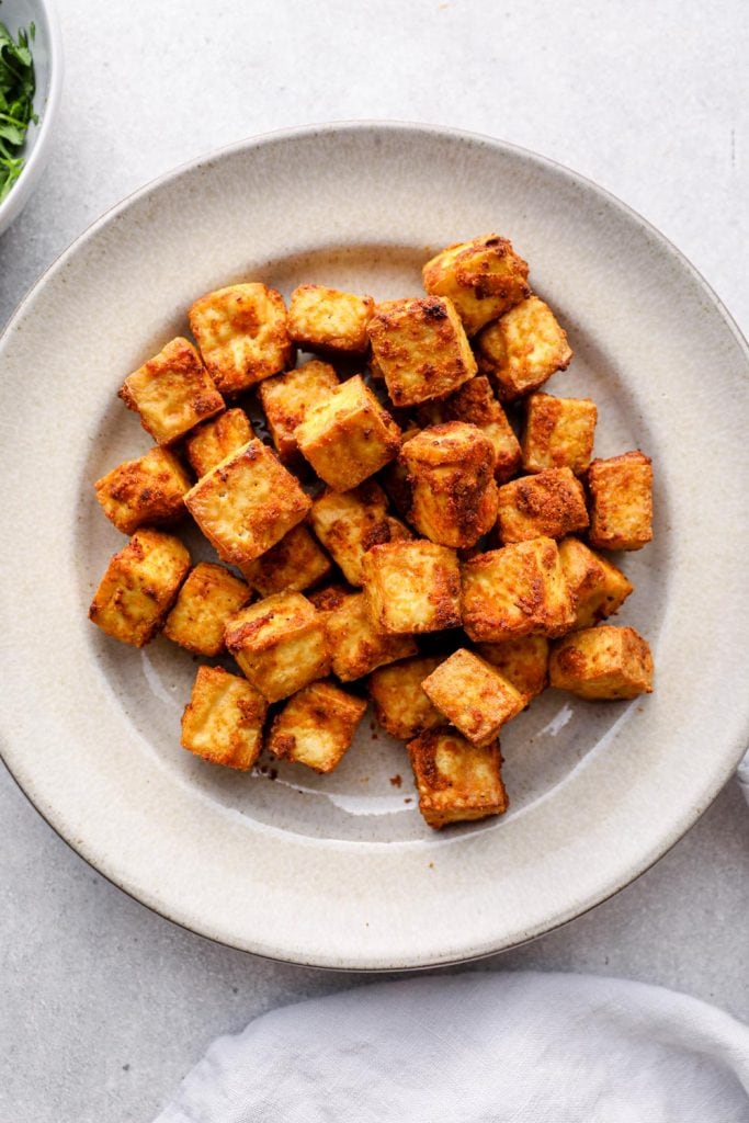 A plate filled with crispy tofu.
