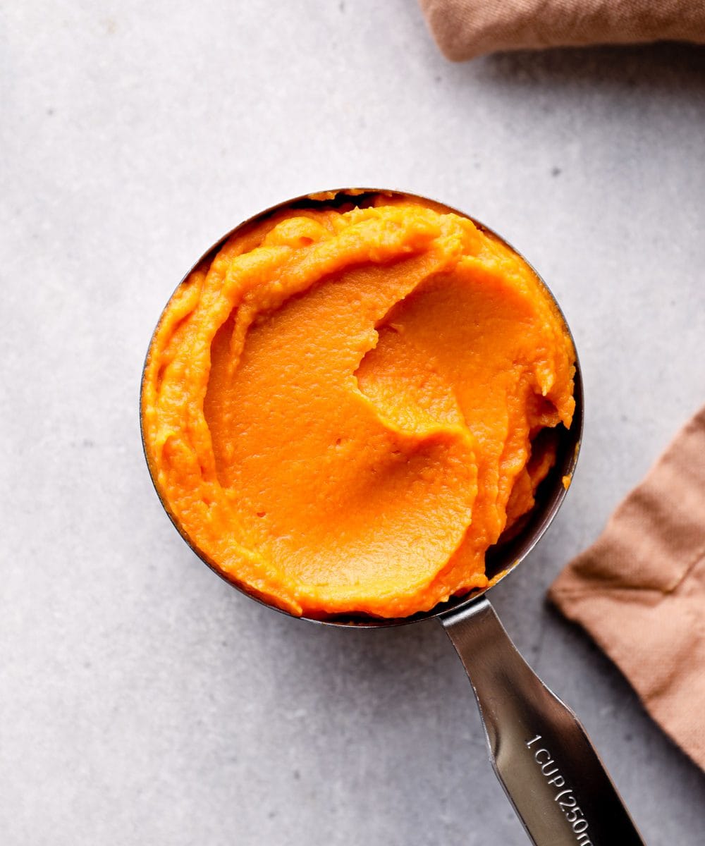 Sweet potato puree in a measuring cup.