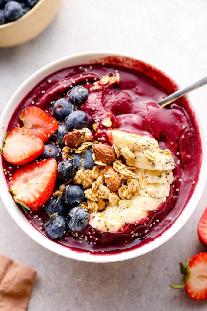 A spoonful of acai smoothie bowl.