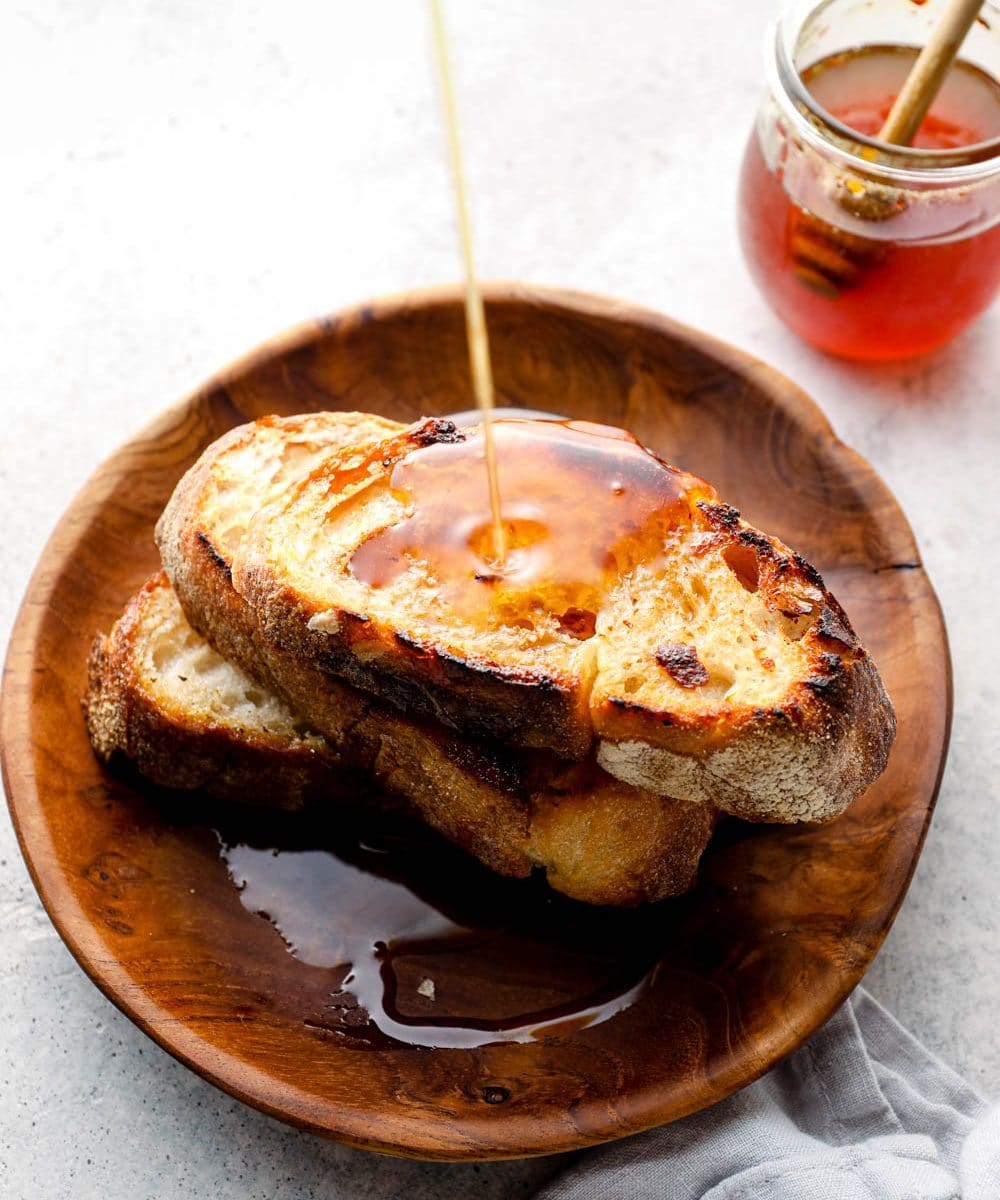 Spicy honey drizzled on toast.