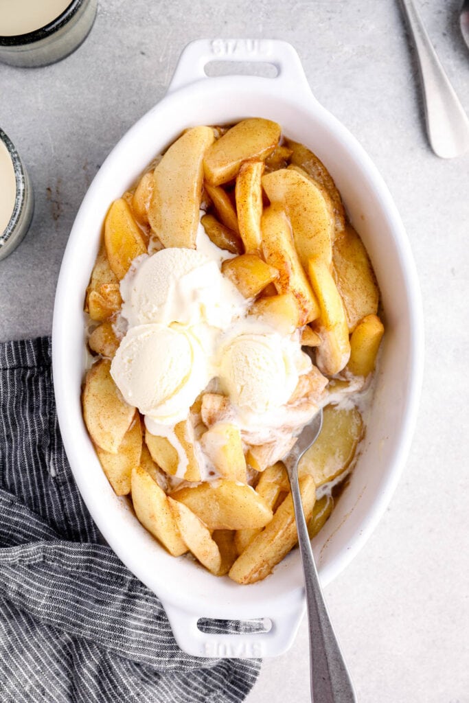 Baked cinnamon apples topped with ice cream.