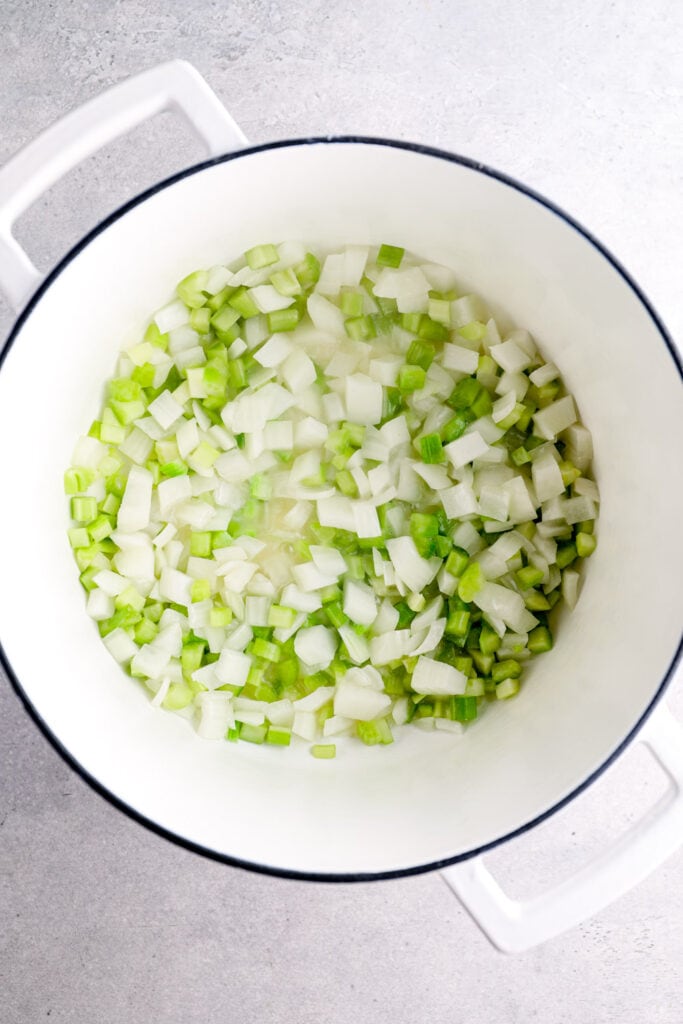 Onions and celery cooking in vegan butter.