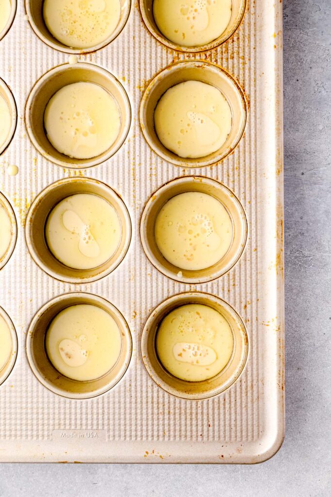 Batter and oil in a hot muffin pan.