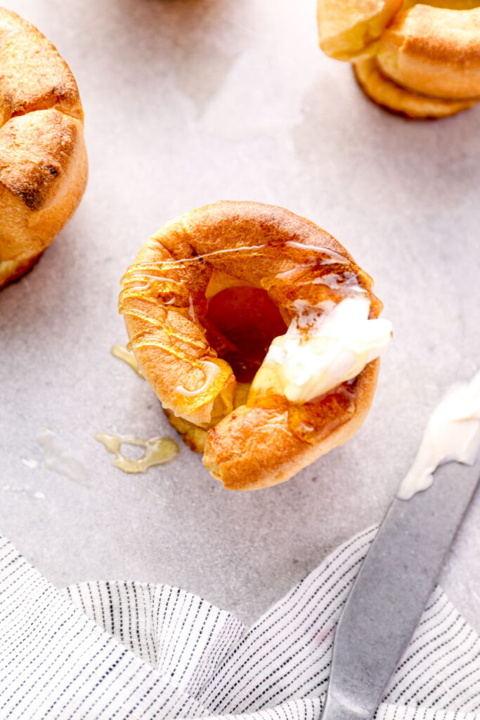 Gluten free yorkshire pudding with butter and honey.