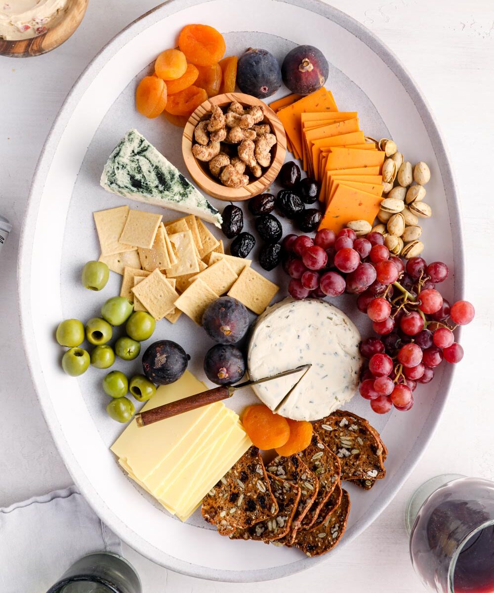 A vegan charcuterie board with crackers and cheese.