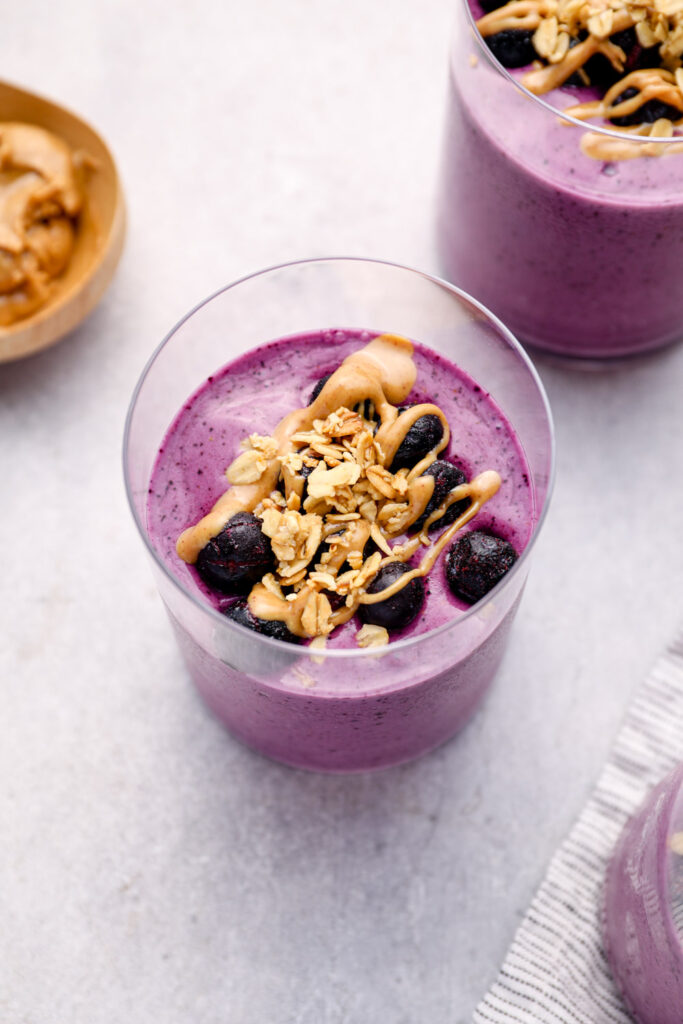 Purple smoothies topped with granola.