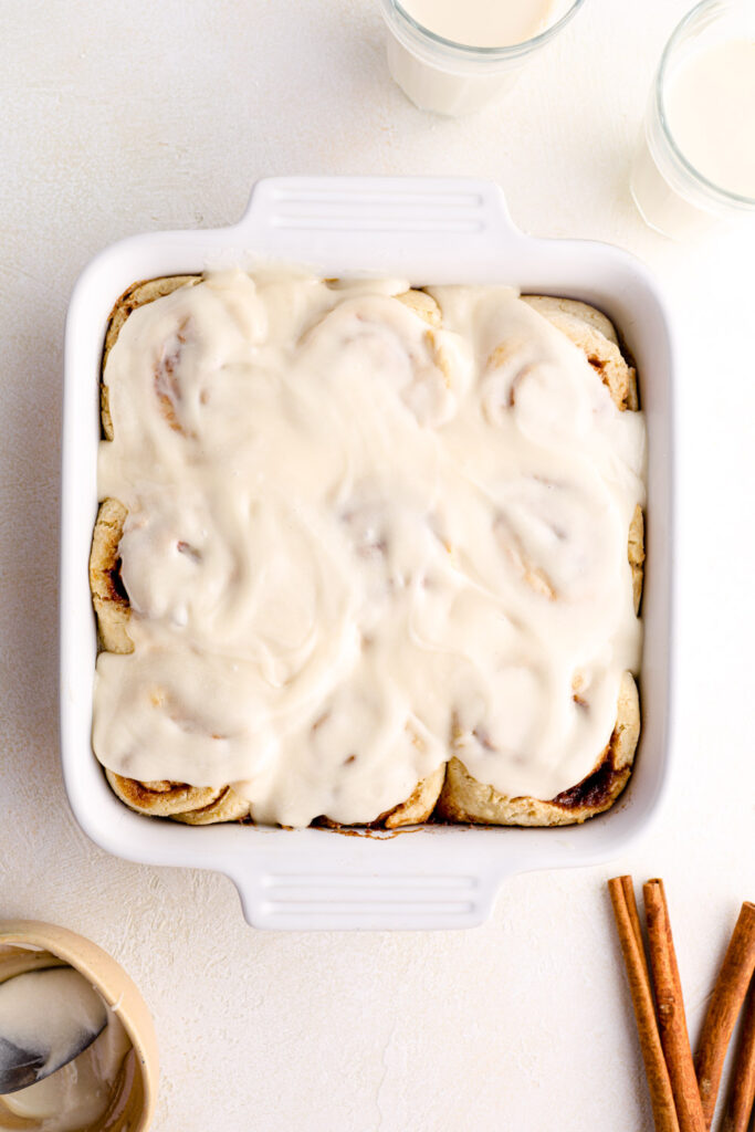 Frosted gluten free cinnamon rolls with cinnamon.