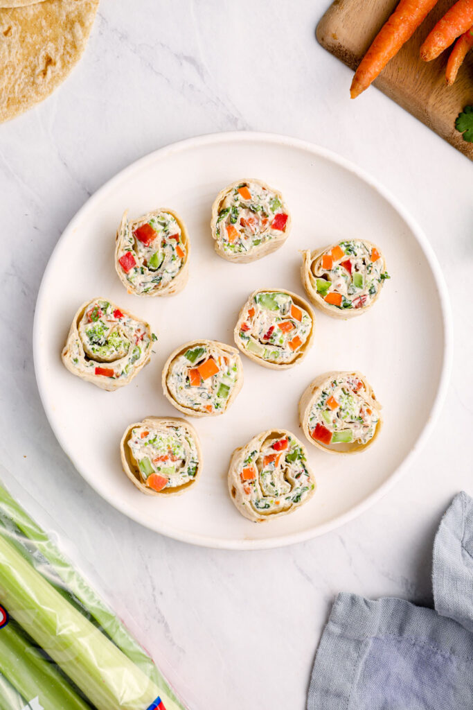 Vegan pinwheels on a white plate.