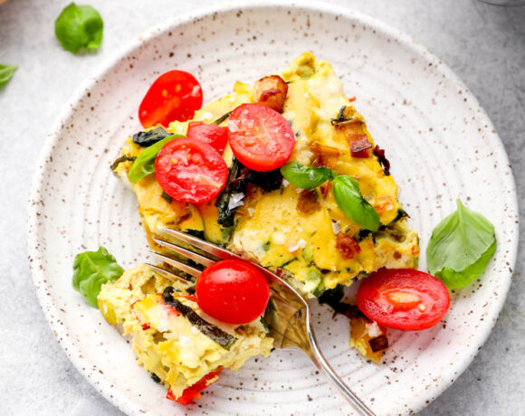 A bite out of a slice of vegan frittata.