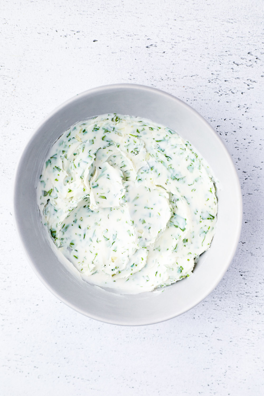 A bowl of vegan cilantro garlic compound butter.